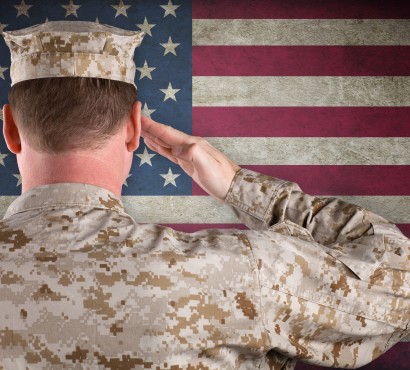 veteran saluting American flag